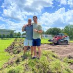 Shuffled Ink's father-son duo, President Charles Levin (left) and CEO Matthew Levin (right) celebrate the official groundbreaking at the site of their new production facility.